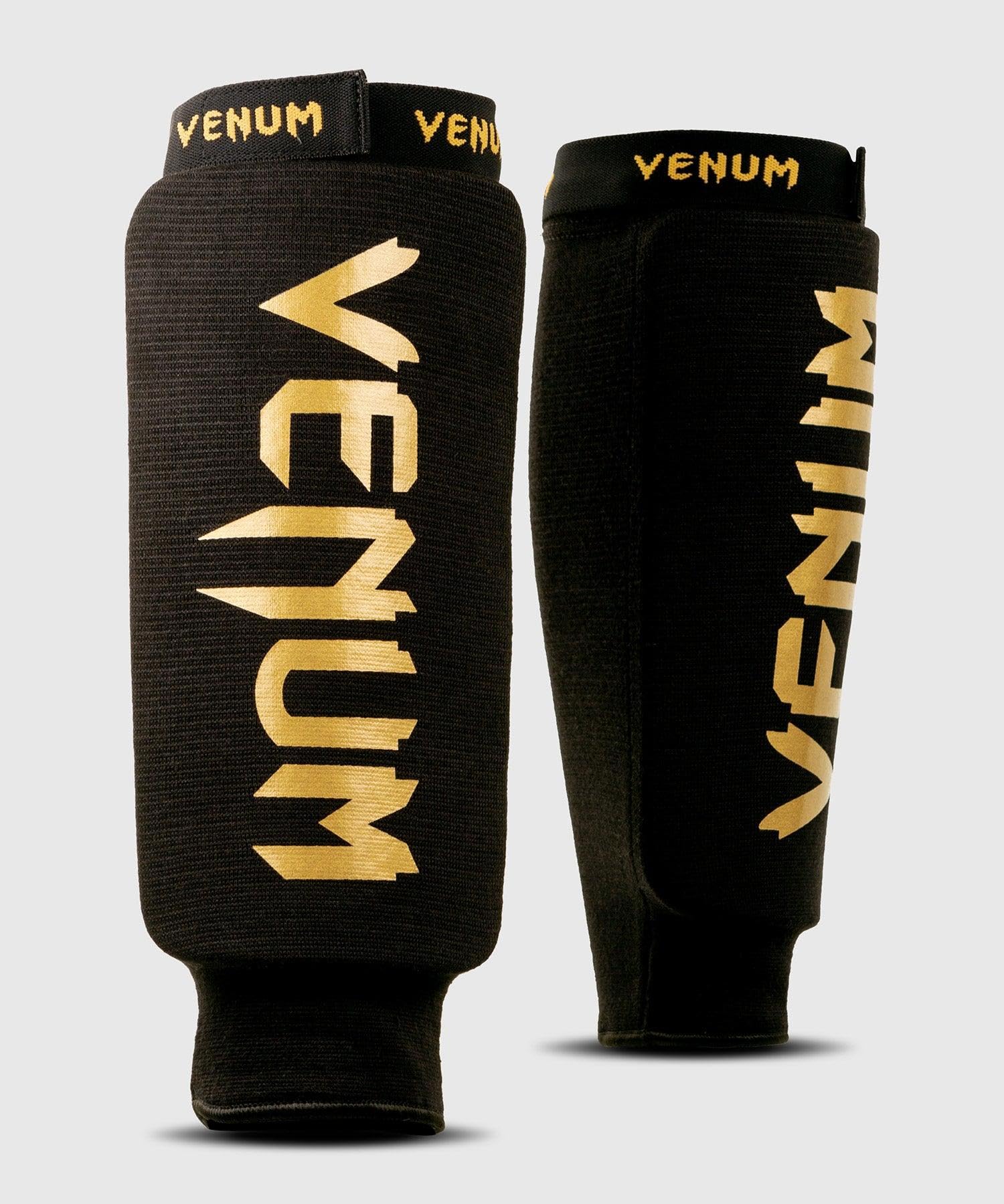 Venum VENUM-0481-126-S Schienbeinschoner, Erwachsene, Unisex, Schwarz/Gold, S